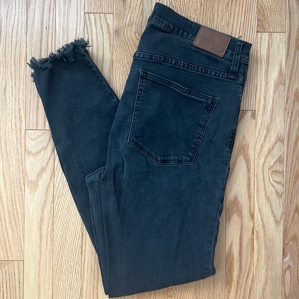Black Madewell button front skinny jeans with fringe bottom